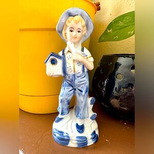Sweet little porcelain boy figurine with birdhouse blue and white